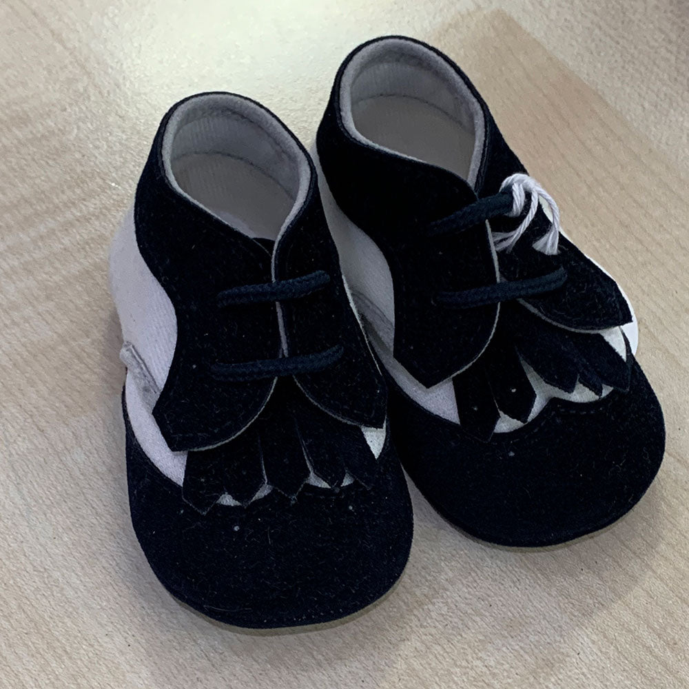 
  Shoes from the Ambarabà children's clothing line, in very soft materials and
  with craftsmans...