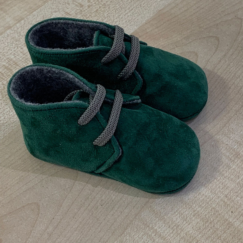 
  Shoes from the Ambarabà children's clothing line, in very soft materials and
  with craftsmans...