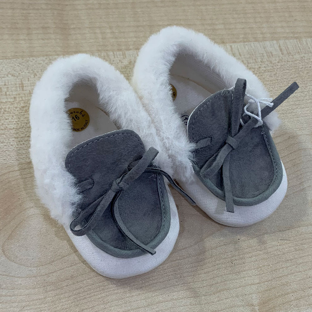 
  Shoes from the Ambarabà children's clothing line, in very soft materials and
  with craftsmans...