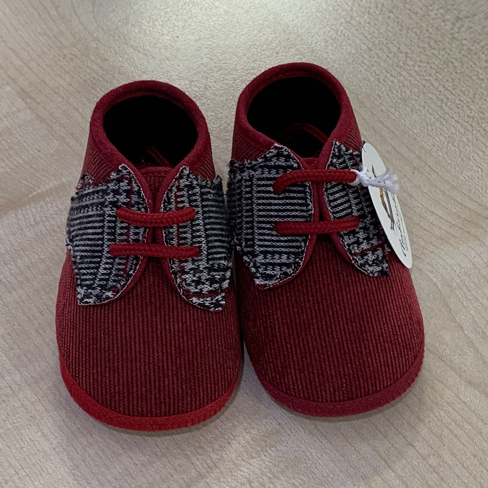 
  Shoes from the Ambarabà children's clothing line, in very soft materials and
  with craftsmans...