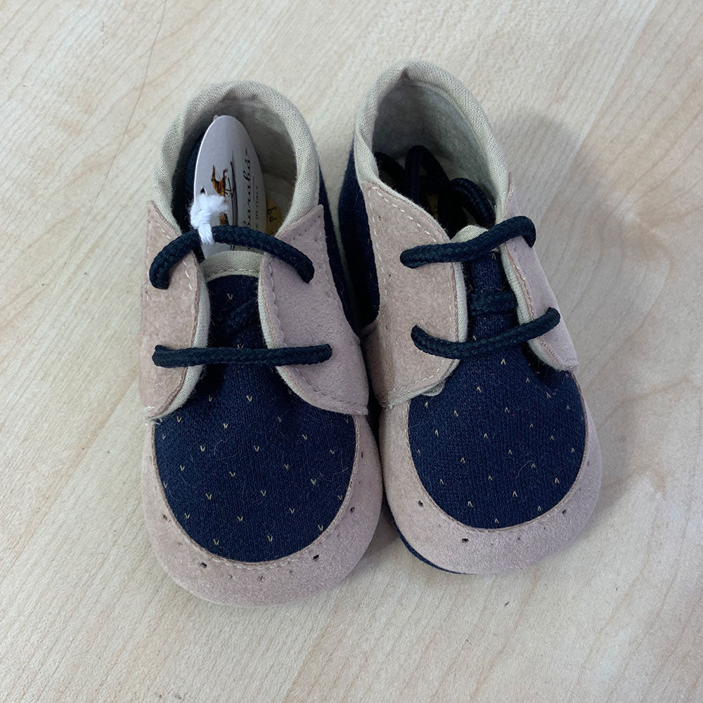 
  Shoes from the Ambarabà children's clothing line, in very soft materials and
  with craftsmans...