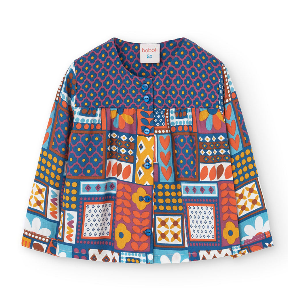 
Shirt from the Boboli Girl's Clothing Line, with brightly colored pattern and buttons on the fro...